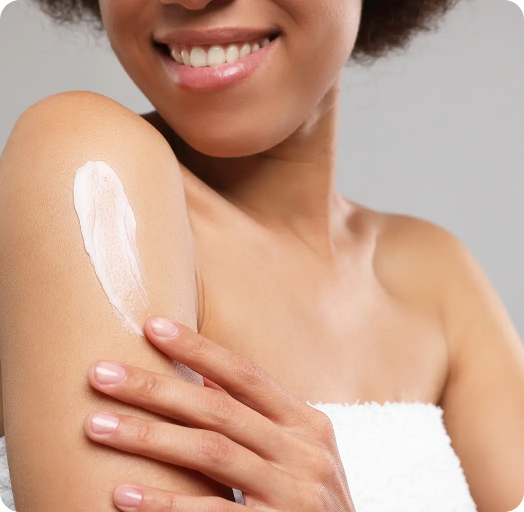 Woman applying a white cream